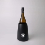 A black wine cooler with a sleek design, featuring a drink bottle inserted inside and a logo on the front.