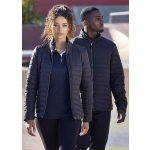 Women&rsquo;s black puffer jacket featuring a fitted design, paired with a model in casual attire, against an outdoor background.