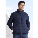 A men's puffer jacket in navy blue, featuring a zip front and standing collar, worn by a model outdoors.