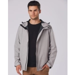 A grey waterproof performance jacket featuring a hood, worn by a model against a plain background.
