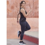 Womens Luna 7/8 length leggings in navy, paired with a black tank top and black sneakers, feature a logo.