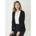 A black women's cardigan featuring a button front and a soft knit texture, worn over a white blouse and black trousers.