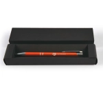 A black cardboard pen box containing a red pen with a silver clip and branding.