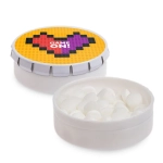 A white mint tin featuring a colorful lid with a heart design, filled with white mint candies.