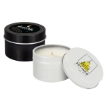 A set of two petite candles in tin containers, one black with a celestial design and the other white with a logo.
