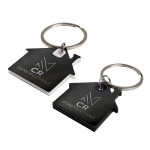 Two house-shaped keytags in black and white, featuring a keyring and a logo on each.