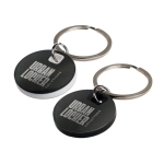 A circular stainless steel keytag in black and white with a metal keyring. Features a logo on the surface.