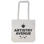 A tote bag with a long handle featuring the text "ARTISTRY AVENUE" and decorative floral elements.
