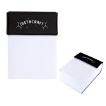 A notepad with a black top cover featuring branding, and a clean white note pad underneath.