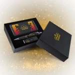 A black gift box containing a pen, a USB drive, and a card with a colorful design.