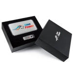 A power bank gift set featuring a silver power bank and a USB drive in a black presentation box.