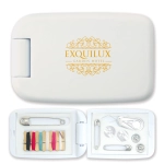 A white sewing kit containing threads, buttons, safety pins, and a needle, with a logo on the exterior.