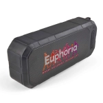 A black, water-resistant speaker with a textured surface and a prominent logo on the front.