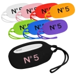 Eight silicone luggage tags in various colours, featuring a slot for writing a name and a logo on each tag.