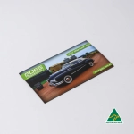 A rectangular fridge magnet featuring a classic black car with a green logo and an Australian Made badge.