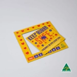 A yellow mini magnetic photo frame with a playful design and a branding logo in the corner.