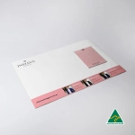 A3 magnetic whiteboard in white featuring a pink notepad, with a logo and branding on the bottom section.