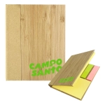 A bamboo-covered sticky note pad featuring yellow, pink, and green sticky notes, with a logo on the front.