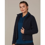 A navy polar fleece jacket with a zip front and high collar, worn over a blue polo shirt. It features a logo.