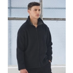 A black polar fleece jacket with a zip and high collar, worn by a male model in a bright, industrial setting.