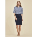 A woman wearing a navy mid waist stretch chino skirt paired with a striped shirt. The skirt features a belt and has a casual look.