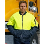 A Hi-Vis two-tone flying jacket in bright yellow and navy, featuring a zipped front and pockets, worn by a man.