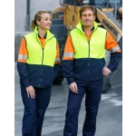 Hi-Vis two-tone polar fleecy vests in bright yellow and navy, worn by a man and woman, featuring reflective stripes.