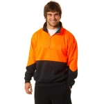 A high-visibility long-sleeve windcheater collar in orange and black, worn by a smiling man. The design includes a zip and a logo.