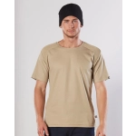 A beige short-sleeve work t-shirt with a textured shoulder design, worn by a model in a black beanie.