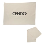 A cream cotton tea towel featuring a logo. The towel is neatly folded beside a larger flat section.