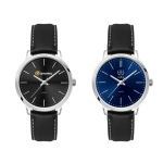 A pair of ladies' dress watches featuring a black and a navy blue dial, both with leather straps and silver-tone cases.