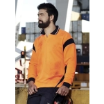 A long sleeve polo shirt in bright orange with navy accents, featuring a logo and worn by a man at a worksite.