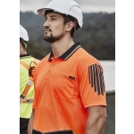 An orange short sleeve polo shirt featuring a logo and black striped design, worn by a man in a hard hat.