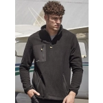 A man wearing a black unisex polar fleece with a quarter-zip and front pockets, set against an aircraft backdrop.