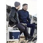 Two men seated outdoors, one wearing a grey reinforced knit hoodie and the other in a navy pullover, holding a drink bottle.