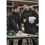 A black unisex Merino wool mid-layer pullover is worn by two men discussing plans at a construction site.
