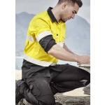 Men's long sleeve shirt in yellow with reflective tape, featuring a black bottom section. Logo present on the shirt.