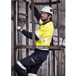 A man wearing a hi-vis yellow and navy work shirt, climbing a metal ladder, with protective gear and glasses.