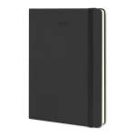 A black Moleskine 2026 planner with a softcover, featuring an elastic band and cream pages.