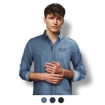 A denim button-up shirt in light blue, featuring a logo on the chest, displayed on a model.
