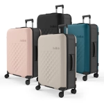 Four Rollink Flex 360 Spinner Suitcases in black, teal, light pink, and cream, featuring diamond-patterned exteriors and wheels.