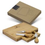 A rectangular bamboo cheese board with three stainless steel knives, packaged in a brown box.